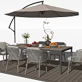 Outdoor Wooden Dining Table With Wicker Chairs Fruit Flowers And Umbrella On Deck