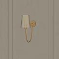 Elegant Golden Wall Lamp Mounted On Vertical Paneled Light Beige Wall With White Lampshade