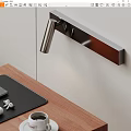 Sleek Modern Metal Wall Lamp Above Wooden Desk With Black Leather Pad And Illuminating Workspace