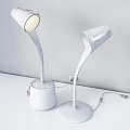 Unique Shaped Desk Lamps With Curved Poles Starry Mug Bases And Black Orange Hues