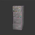 Silver Metal Drawer Cabinet With Multiple Stacked Drawers And Labeled Stickers