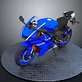 Sleek Blue Sport Motorcycle With Black Seat On Metallic Circular Platform