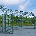 Outdoor Metal Arched Pergola With Greenery Blue Sky And Paved Plaza