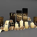 Floral Installation for Fashion Show with Gold Black Columns and Decorative Elements