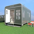 Green Trailer With Open Door Parked Near 4x4 Vehicle Folding Table Red Chairs On Grass