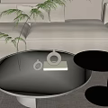 Modern White Round Coffee Table Featuring Black Side Table Vase Decorative Items And Books