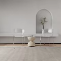 Modern Minimalist Interior Featuring Transparent Chairs And Beige Round Table With Arched Doorway