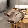 Comfortable Brown Striped Slippers With Soft Cushioned Sole Placed On Wooden Tray For Home Use