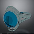 Silver Ring With Large Blue Gemstone And Surrounding Small Diamonds