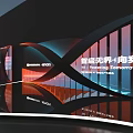 Modern Illuminated Sculpture Installation With Welcome Sign And Striped Building Background