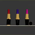 Colorful Lipsticks With Black Cases And Gold Bases Open Closed On Wooden Tray