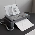 Efficient Office Appliance Fax Machine with Paper Output and Telephone Handset on Desk