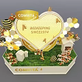 Comvita Product Display With Yellow Background Hexagon Shelves White Pillars And Flower Decorations