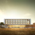 Multi Story Modern School Building With Glass Windows And Open Grassy Area