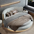 Round Bed With White Headboard Brown Beige Pillows Gray Brown Blanket Modern Bedroom