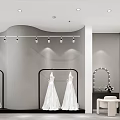 Wedding Dress Shop Interior With White Wedding Dresses Black Gown And Modern Lighting