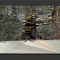 Natural Scenery Featuring Rocky Cave Entrance With Vines Fallen Leaves And Small Stream
