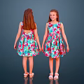 Two Girls Posing Back and Front Wearing Floral Dresses Against Dark Blue Background