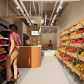 Fresh Fruit Store Interior Featuring Various Fruits on Shelves and Customers Selecting Produce