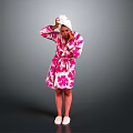 Pink Floral Bath Robe With White Towel On Head Standing Against Gray Background