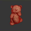 Standing Cream Colored Ceramic Bear Figurine With Orange Spots On Dark Surface 3d model