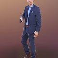 Man in Dark Blue Suit Light Blue Shirt Brown Belt Pocket Square Standing Pose