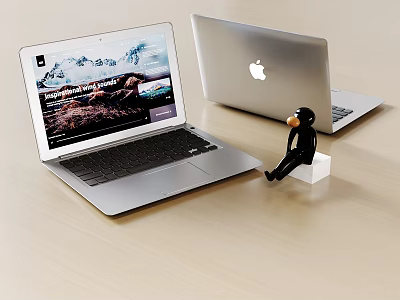 Open Laptop With Scenic Screen Display And Closed Apple Logo Laptop Nearby Small Monkey Figure 3d model