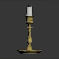 Brass Candlestick With White Candle On Black Background And Ornate Base
