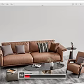 Modern Brown Leather Sofa and Coffee Table Set with Accent Chair Pillows and Decorative Items