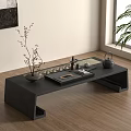 Modern Minimalist Tea Set On Black Tea Table With Decorative Plant And Accessories