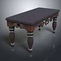 Dark Wooden Table Featuring Intricate Carved Details and White Ring Accents on Legs
