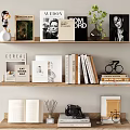 Curated Books Magazines On Shelves With Open Book Plant And Camera Decor