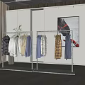 Two Modern Metal Clothes Racks Displaying Various Shirts In Minimalist Room
