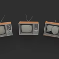 Three Vintage Televisions With Antennas Including One Cracked Screen On Dark