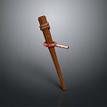 Brown Wooden Stick With Red Strap Tied Around Middle Section