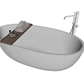 Modern White Oval Bathtub with Water Tray Folded Towels Toiletries and Shower Fixture