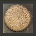 Brown Round Woven Storage Basket With Lid And Woven Texture On Mat
