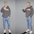 The Man Holding Mobile Phone In Dark Hoodie Blue Jeans And White Sneakers