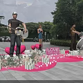 Outdoor Music Performance With Guitar Singer Drums Love Sign Heart Decorations Candles And Flowers