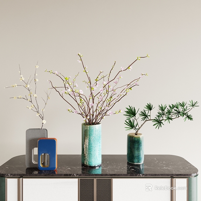 Decorative Ceramic Vases With White Flowers And Green Branches On Black Marble Tabletop 3d model 