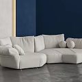 Modern Curved Sectional Sofa With Soft Ivory Linen Plush Cushions And Neutral Walls Interior