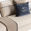 Stylish Beige Sectional Sofa With Striped Armrests Decorative Pillows And Throw Blanket