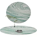 Round Rug Featuring Green and White Marbled Design with Small Fern and Tablet