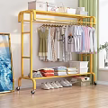 Gold Rolling Clothing Rack With Hanging Folded Clothes And Shoes