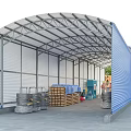 Blue And White Warehouse Storage Shelter With Stacked Wooden Pallets Barrels And Equipment