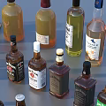 Multiple Liquor Bottles In Various Colors And Shapes Arranged On Blue Background