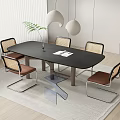 Modern Dining Table Set With Rattan Back Chairs Black Tabletop And Green Plant Decor