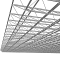 Metal Grid Frame Structure as Architectural Roof Support Against Blue Sky With Clouds
