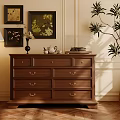 Brown Wooden Sideboard With Drawers Framed Paintings Floor Lamp And Potted Plant