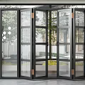 Modern Folding Glass Doors With Black Frames And Garden View For Interior Design